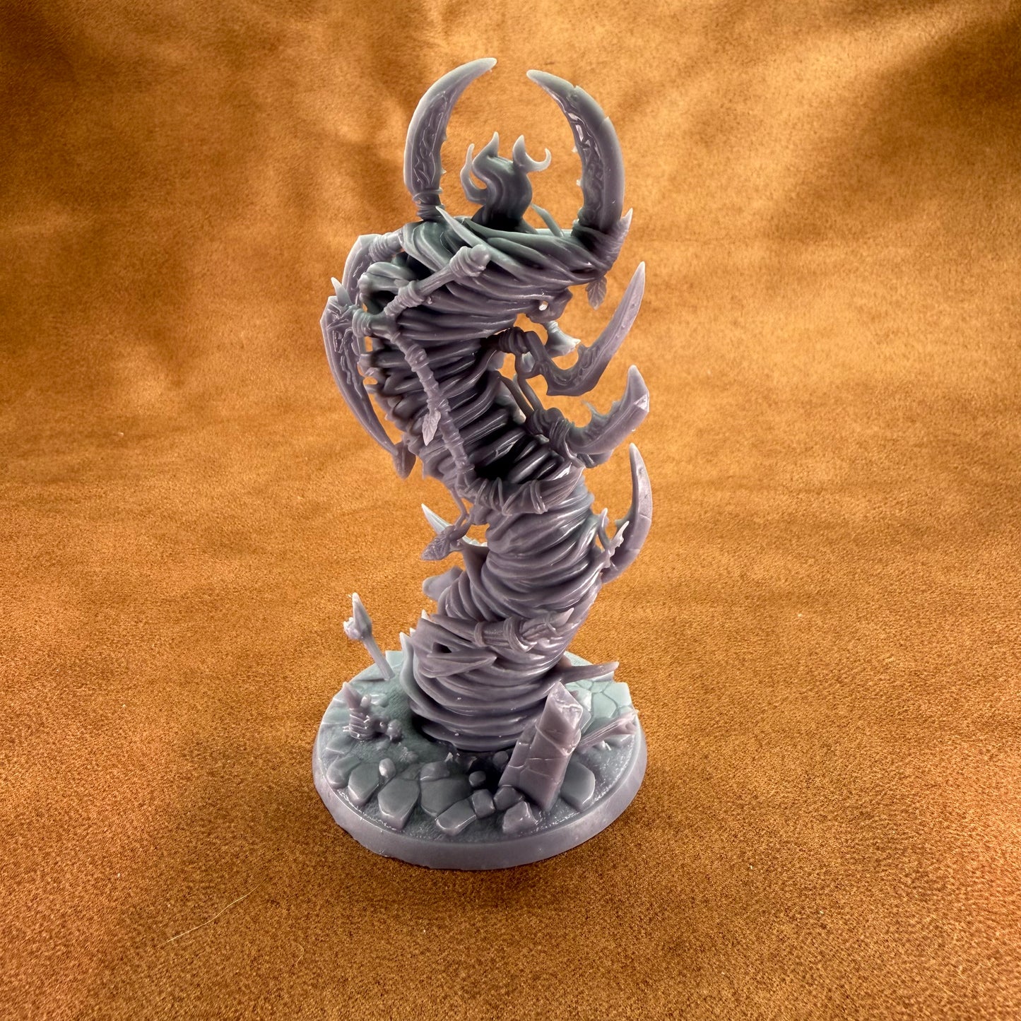 Fantasy creature figurine on a textured brown surface