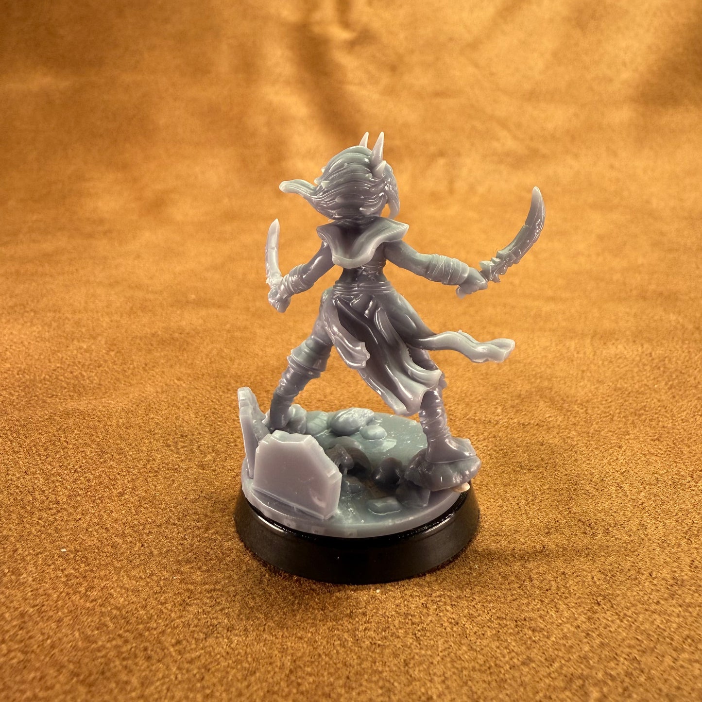 Fantasy figurine on a brown surface