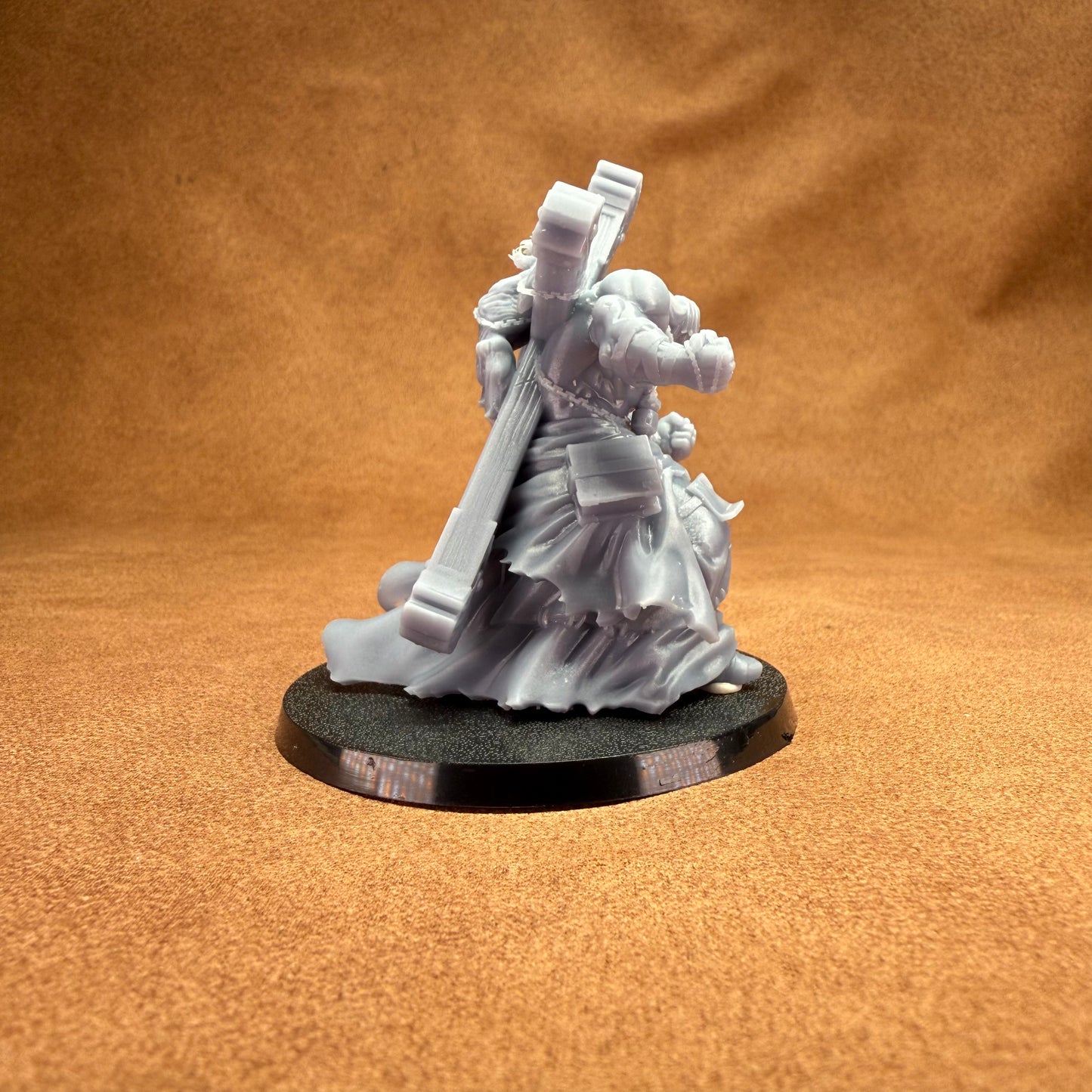 32mm scale man carrying a cross with person on for dungeons and dragons