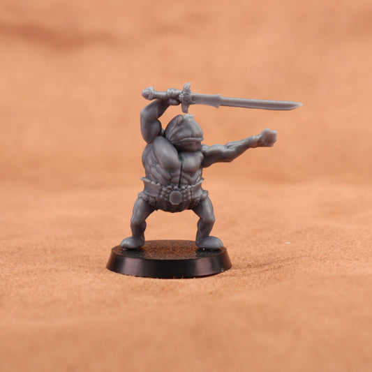 A gray unpainted fantasy warrior miniature figurine holding a sword over its head, standing on a round black base against a warm brown textured background.