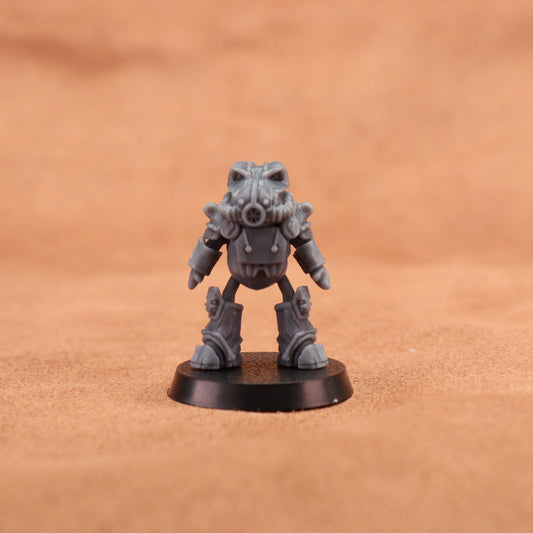 A small gray sci-fi miniature figurine standing on a round black base against a warm brown textured background.