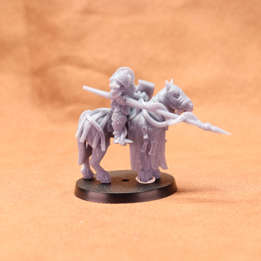 Gray miniature figure on a round base against an orange background