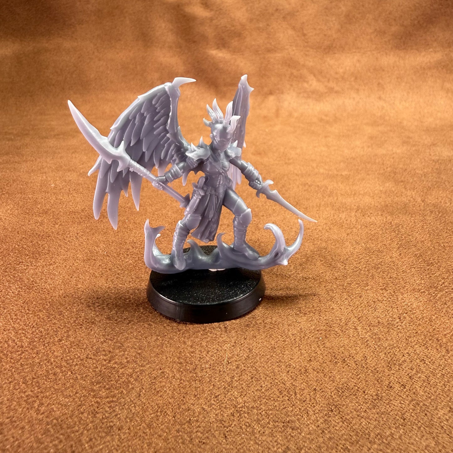 Fantasy figurine on a brown surface