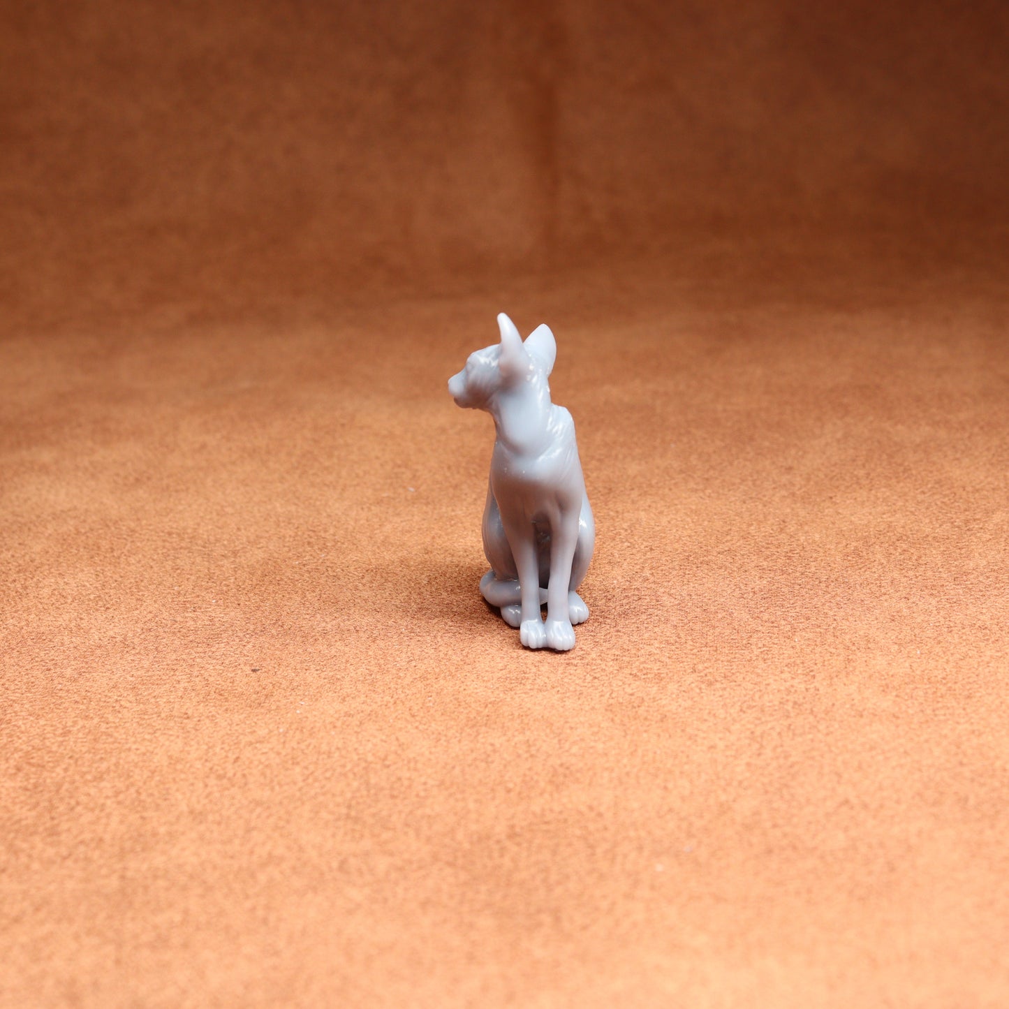 White dog figurine on a brown surface