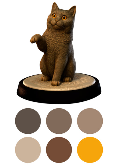 Cat figurine on a round base with color swatches below
