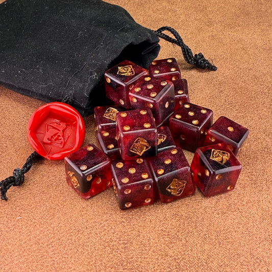 Red and black dice with rogue emblem and gold ink