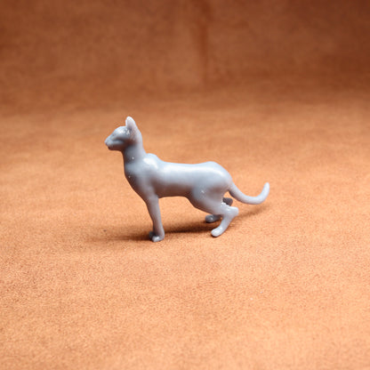 Gray toy dog figure on a brown surface