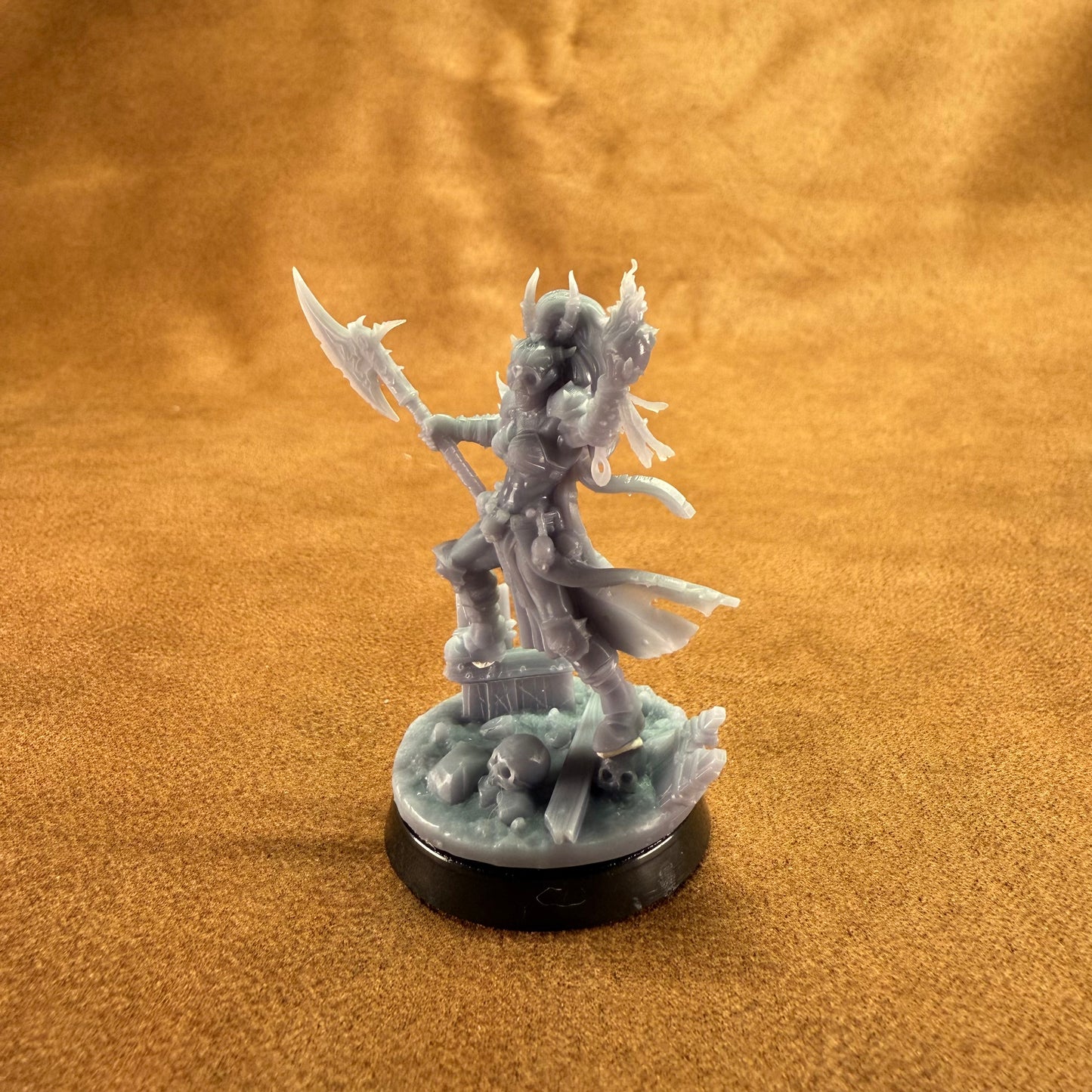 Fantasy figurine on a brown textured background