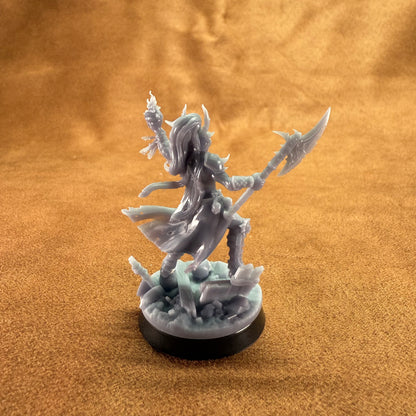 Fantasy figurine on a round base against a brown background