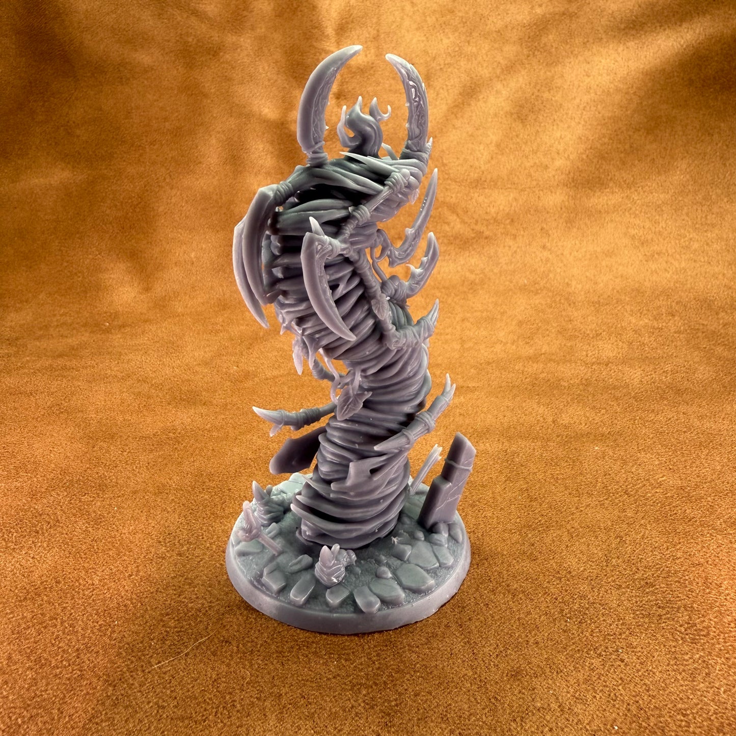 Fantasy creature figurine on a textured brown surface