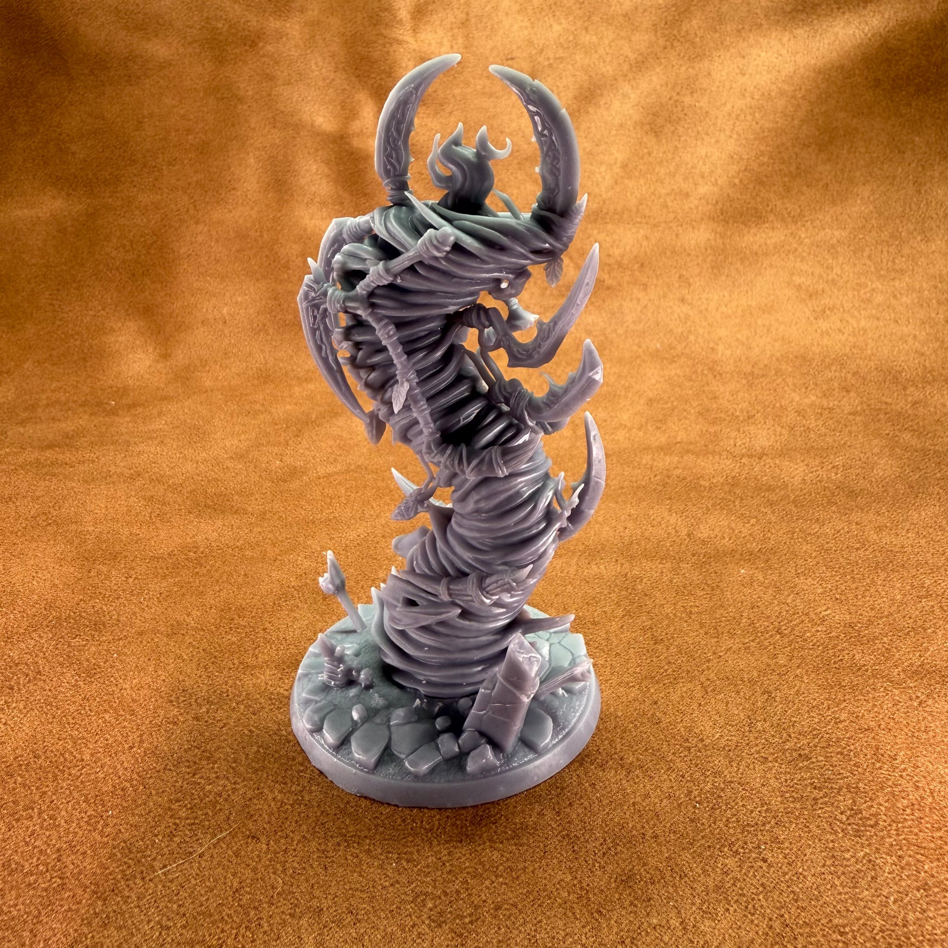 Fantasy creature figurine on a textured brown surface