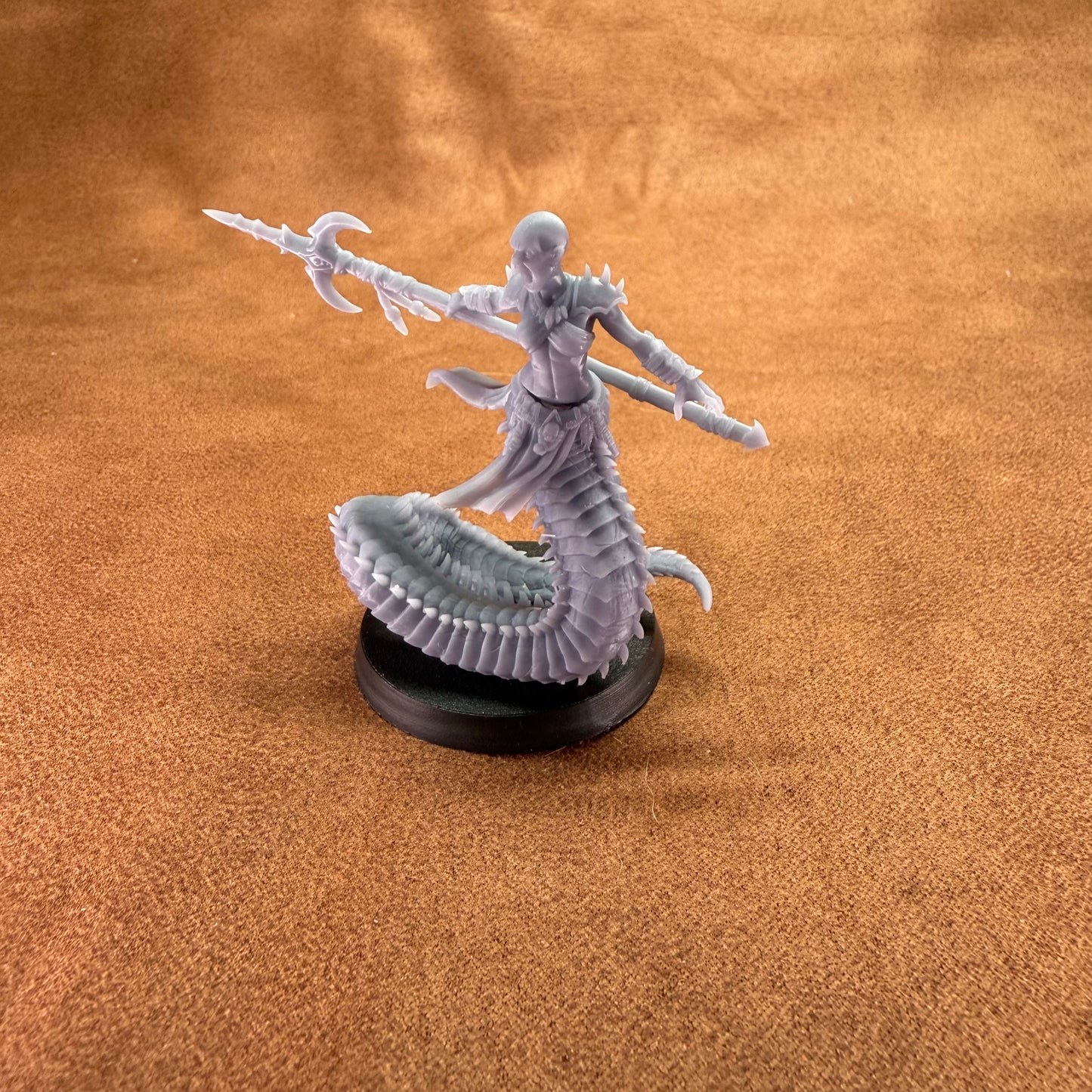 Fantasy figurine on a brown surface