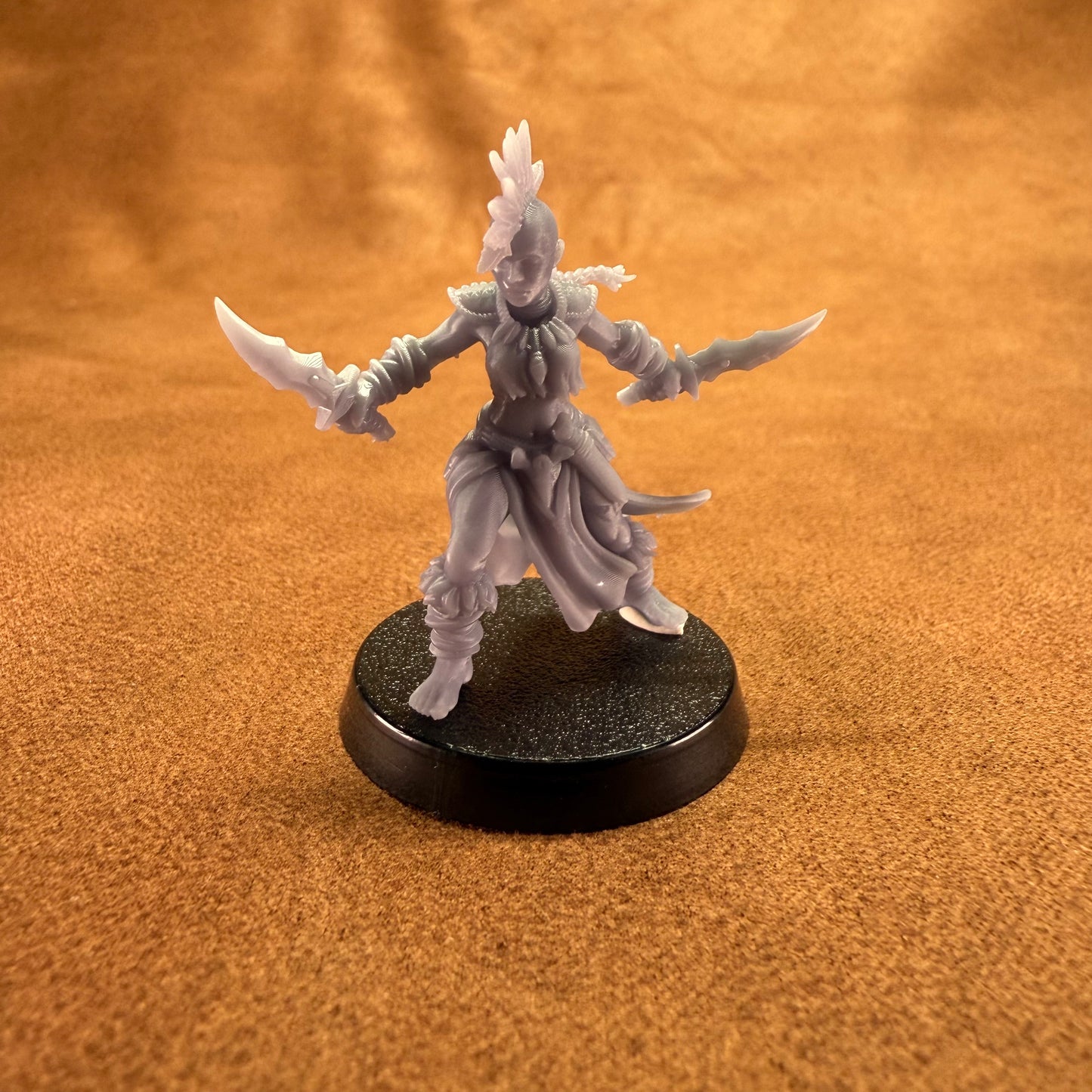 Fantasy figurine on a brown textured background