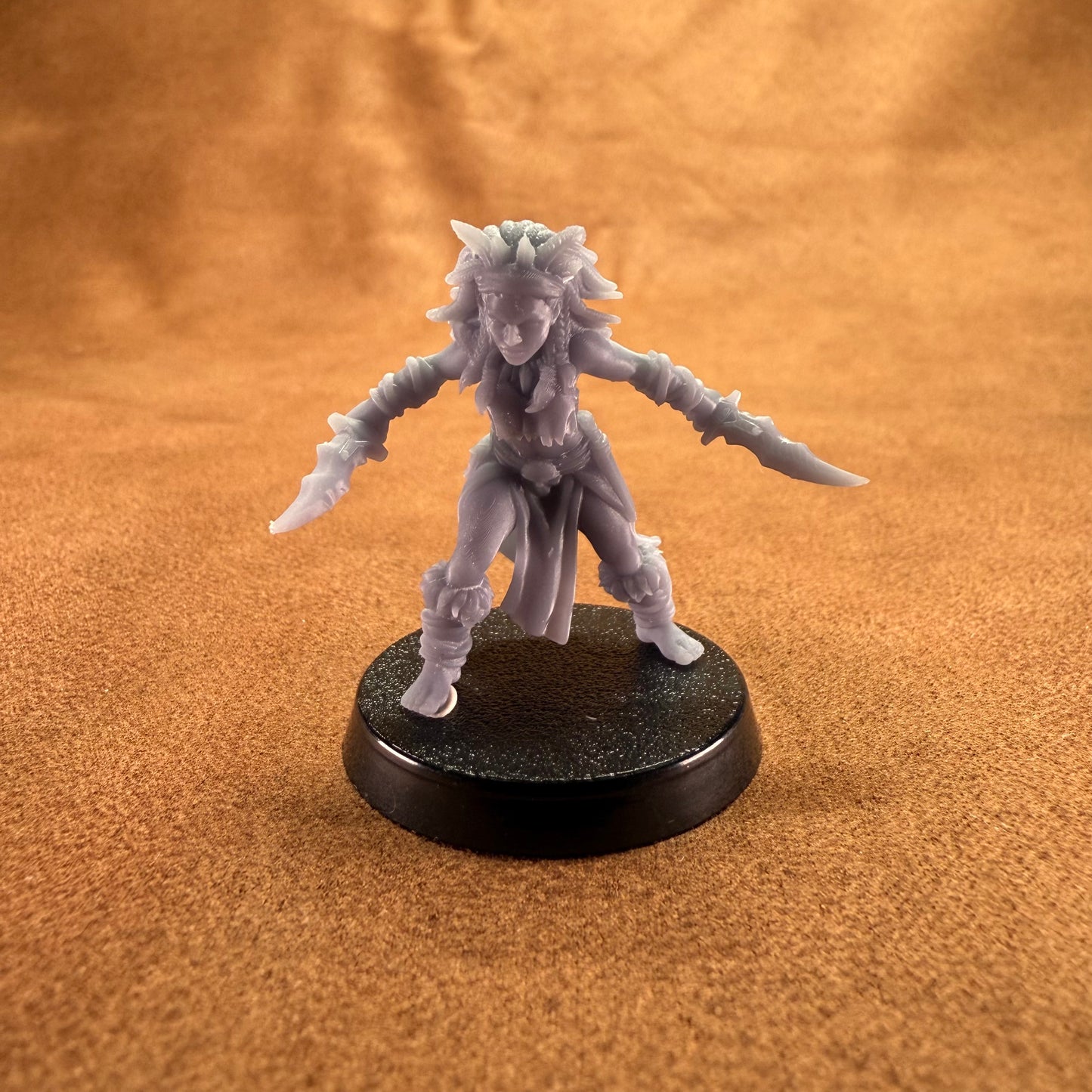 Miniature figurine on a brown surface