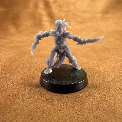 Gray fantasy figurine on a black base against a brown background