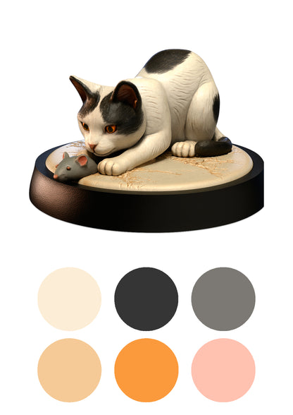 Cat figurine with a mouse on a black base, surrounded by color swatches.