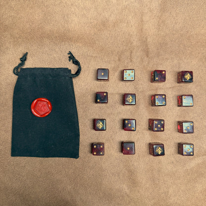 Red and black dice with rogue emblem and gold ink