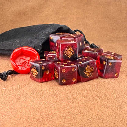 Red and black dice with rogue emblem and gold ink