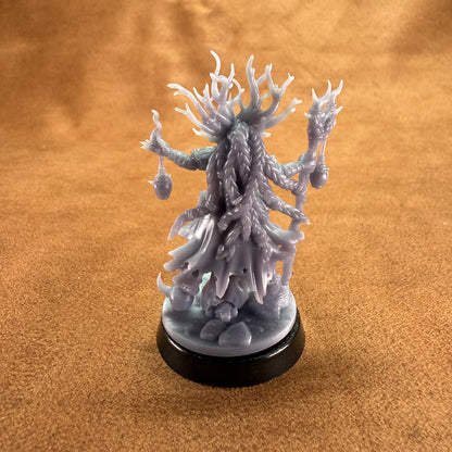White fantasy creature figurine on a brown surface