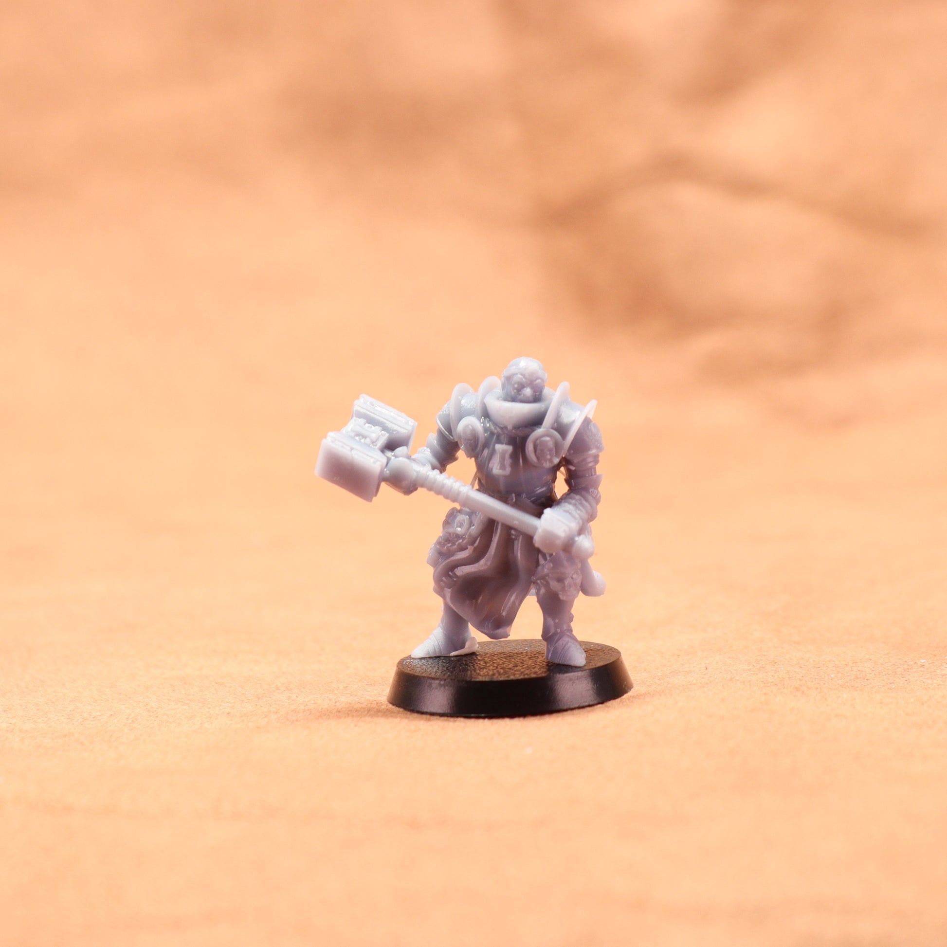 Miniature figurine of a warrior holding a axe on an orange background