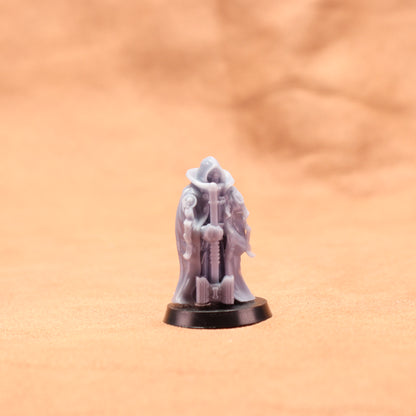 Miniature figurine on a peach-colored background