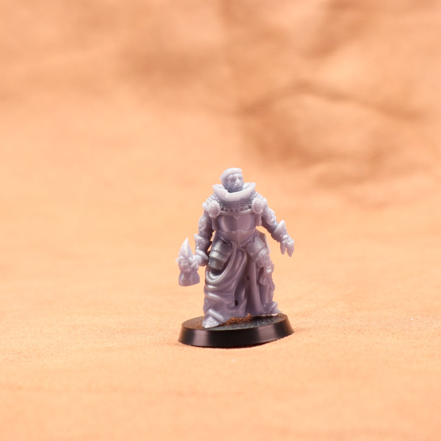Miniature figurine on a beige surface