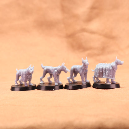 Five white wolf figurines on black bases against a beige background