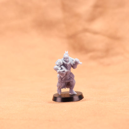 Miniature figurine on a round base against a beige background