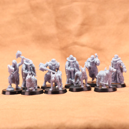 Set of gray miniature figures on black bases against a brown background