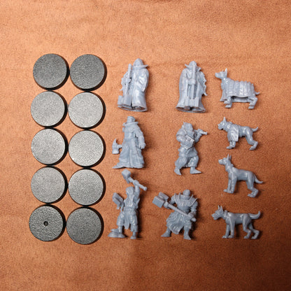 Collection of gray miniature figures and round components on a brown surface