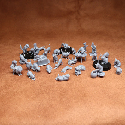 Collection of small gray figurines on a brown surface