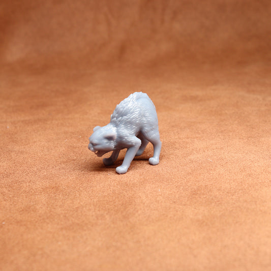 White 3D-printed cat figurine on a brown surface