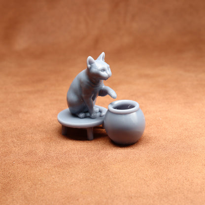 Gray ceramic cat figurine with a small table and pot on a brown background