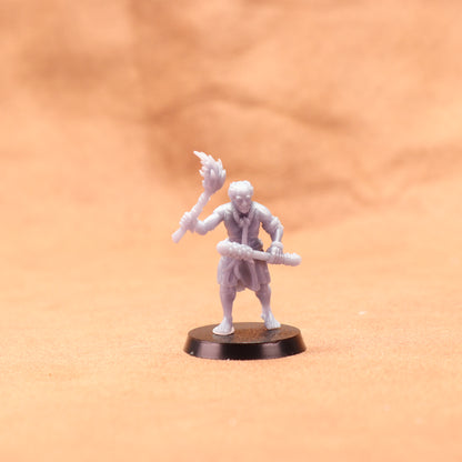 White miniature figure on a brown base against an orange background