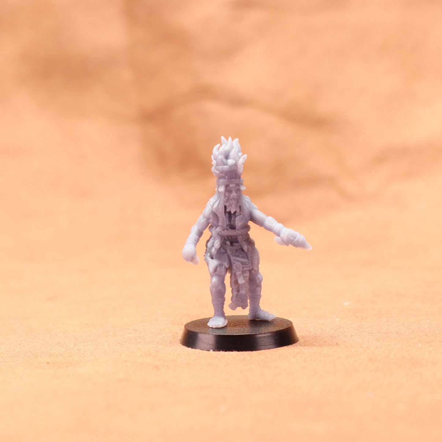 Miniature figurine on a brown surface