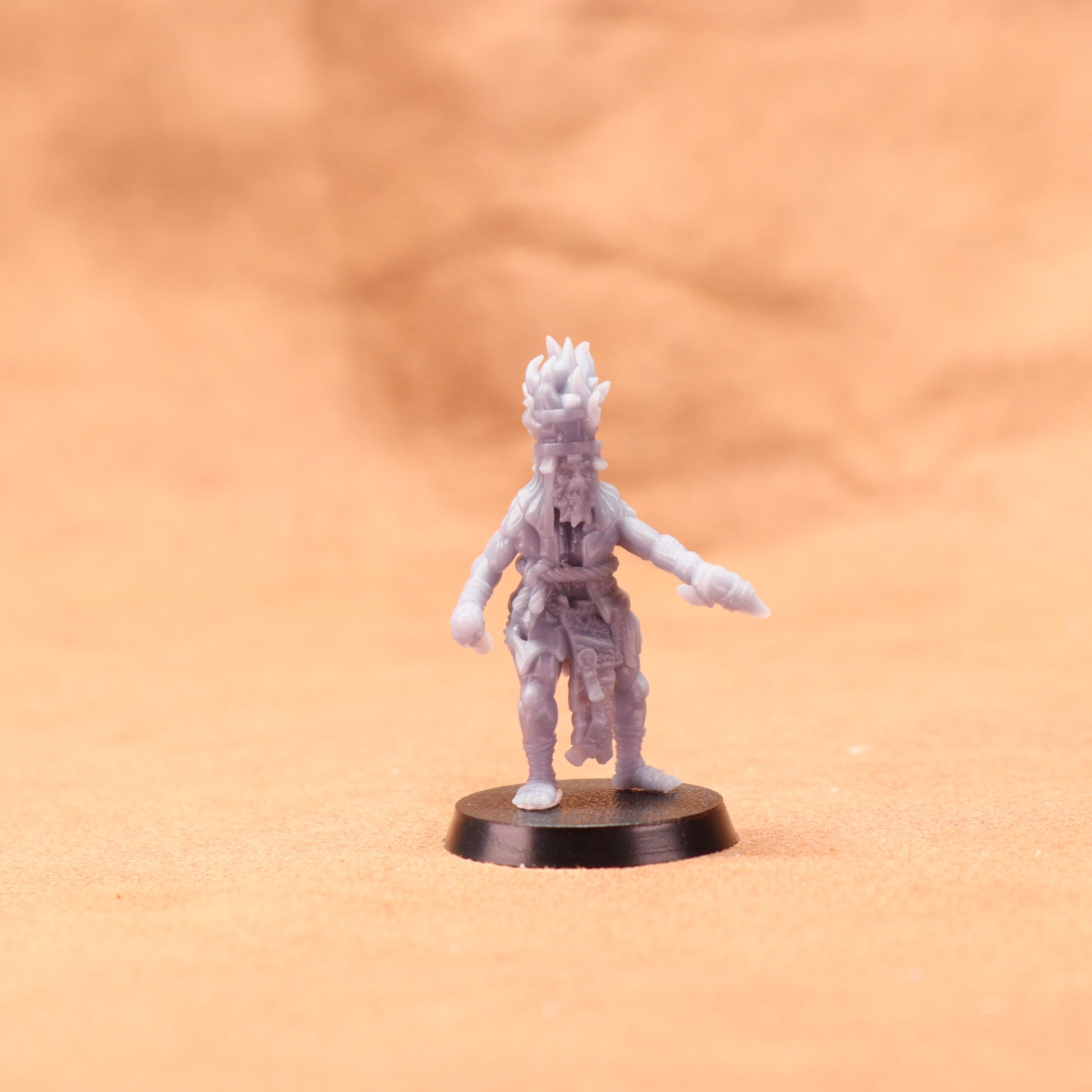 Miniature figurine on a brown surface