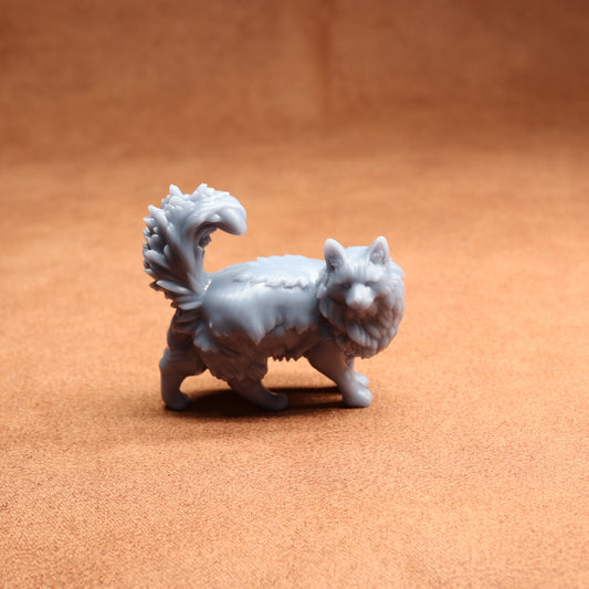 White fantasy creature figurine on a brown surface