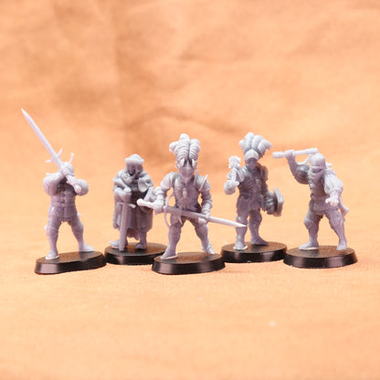 Five white miniature figures on black bases against an orange background