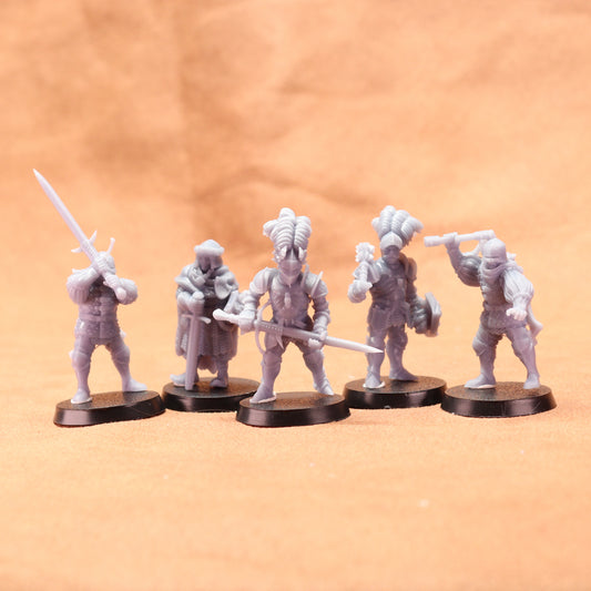 Five white miniature figures on black bases against an orange background