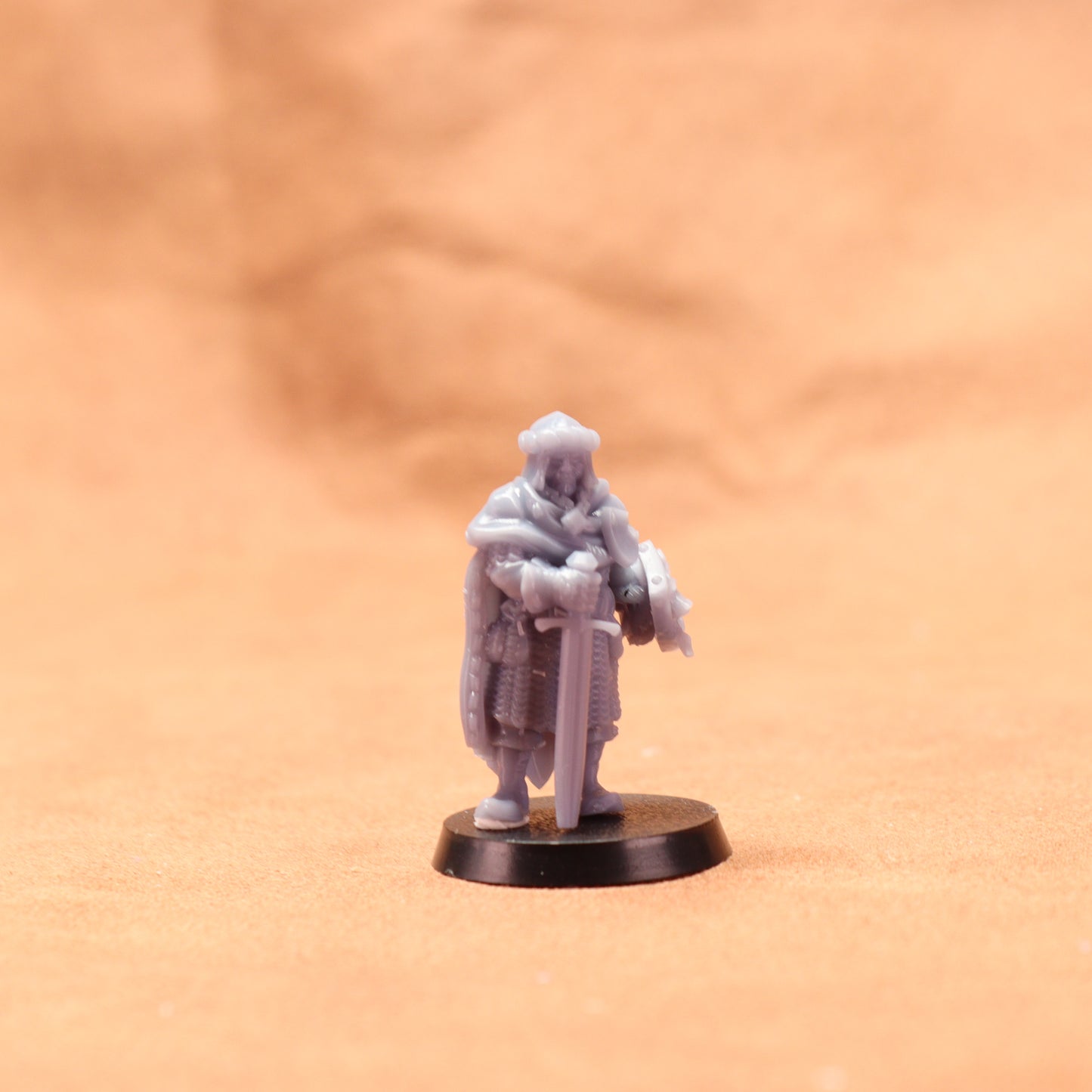 Miniature figurine on a brown surface