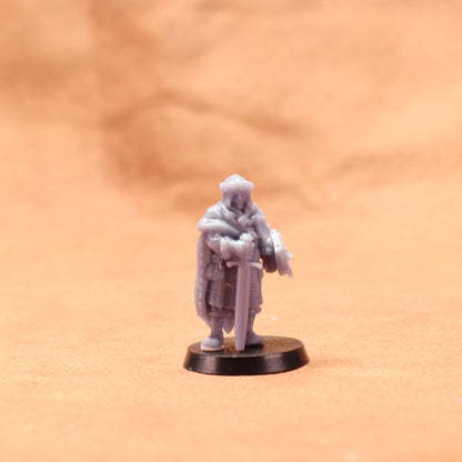 Miniature figurine on a brown surface