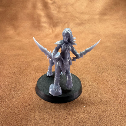 Gray fantasy figurine with horns on a brown surface