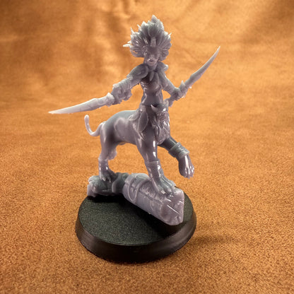 Gray fantasy figurine on a black base against an orange background