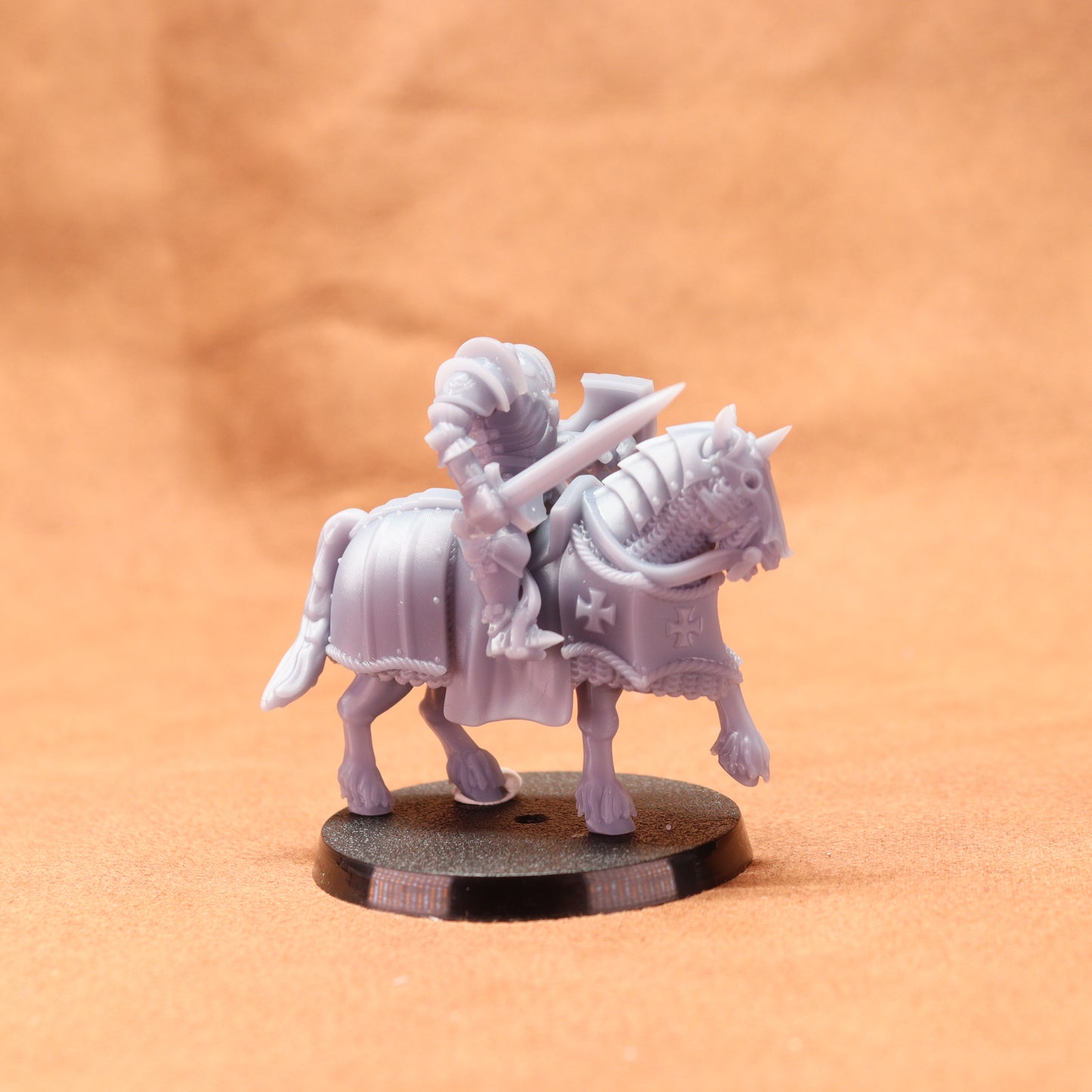 White plastic horse and rider figure on a brown background