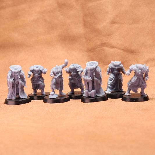 Set of eight gray miniature figures on black stands against a brown background