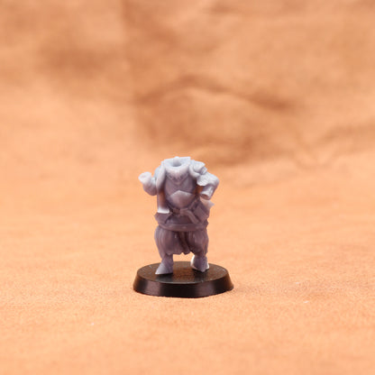 Small figurine on a round base against a brown background
