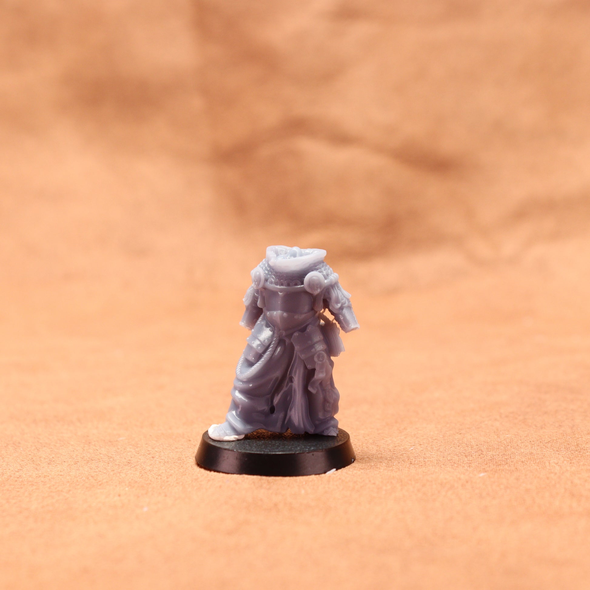 Miniature figurine on a brown surface
