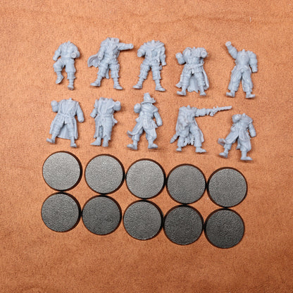 Set of gray miniature figures and round metal pieces on a brown surface