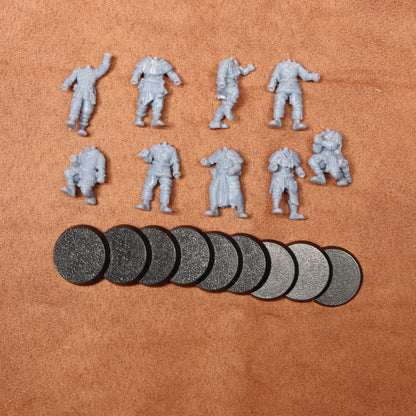 Set of miniature figures and round components on a brown surface
