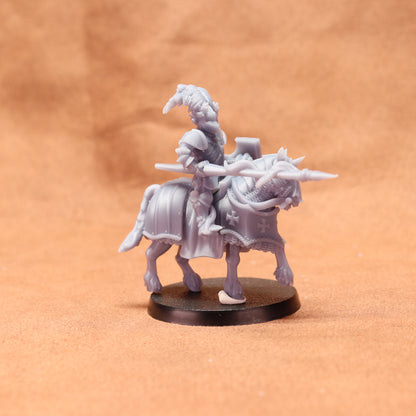 Minature figure of a warrior on horseback with armor and spear on a brown background